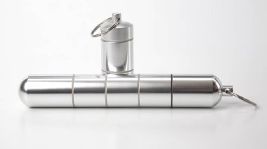 sealed aluminum containers for small items and medical pills on 