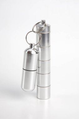 sealed aluminum containers for small items and medical pills on 