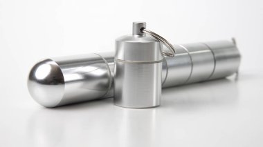 sealed aluminum containers for small items and medical pills on 