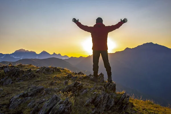 Man Raised Hands Standing Mountain Face Sunrise Tourist Traveler Mountains — Stock Photo, Image