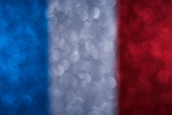 Background image of the flag of France. New Year decoration. Beautiful background from spangles, glitter. Small and large circles