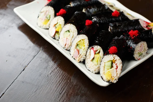 Set Korean Rolls Black Shell White Plate Closeup Photo — Stock Photo, Image