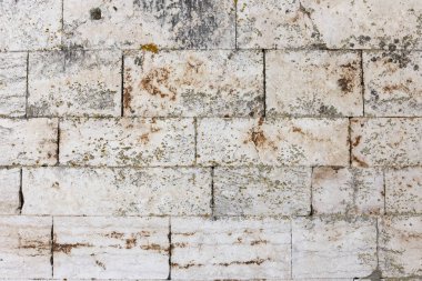 A dirty smudged old White bricks.