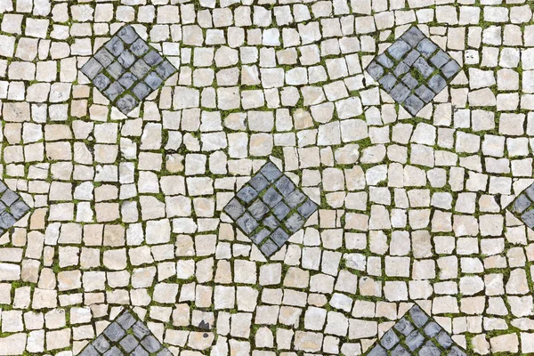 Pavement, lined with old stone tiles