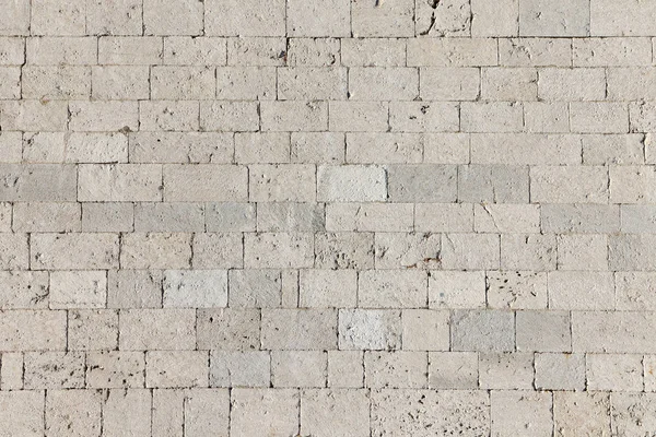 A dirty smudged old White bricks.