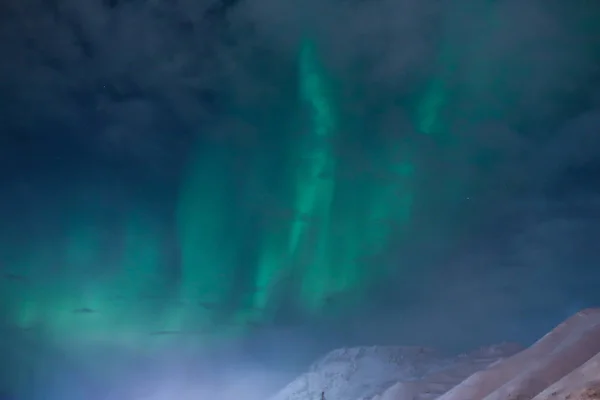 Northern lights on the background-night mountains — Stock Photo, Image