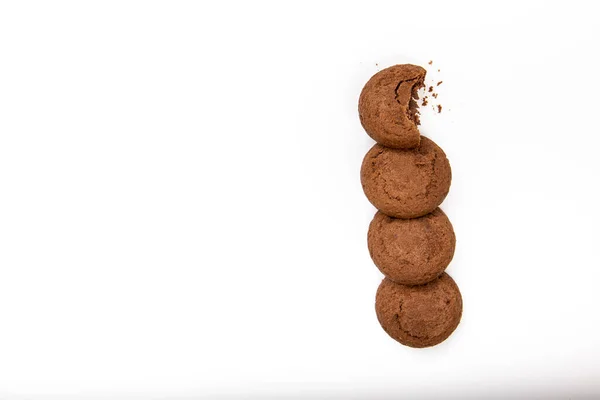 stock image Brown chocolate chip cookies with soft tasty filling inside on a white background