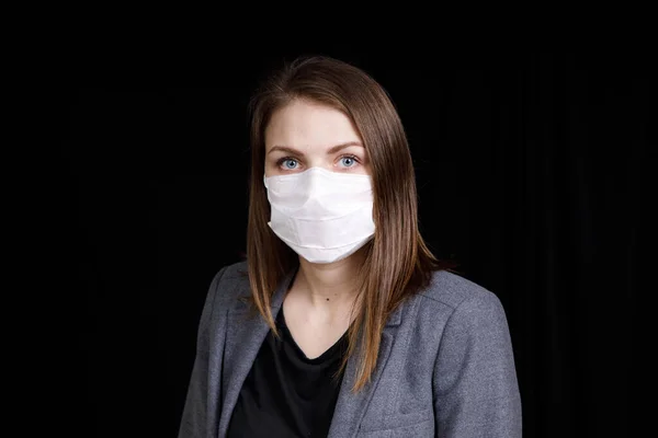 Coronavirus in China. Novel coronavirus (2019-nCoV), woman in white medical face mask. Concept of coronavirus quarantine