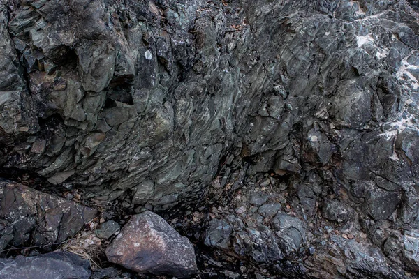 La struttura delle pietre e lo sfondo. Lo sfondo roccioso — Foto Stock