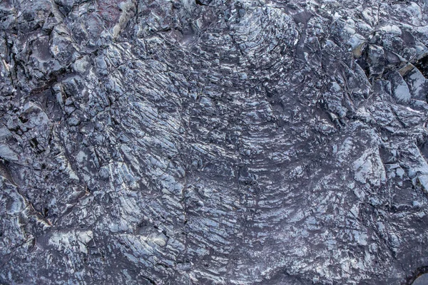 Textura a pozadí zkamenělé lávy. Prehistorická skalní formace — Stock fotografie