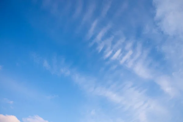 Beautiful pen cloud stripes on a blue sky. Light background and texture