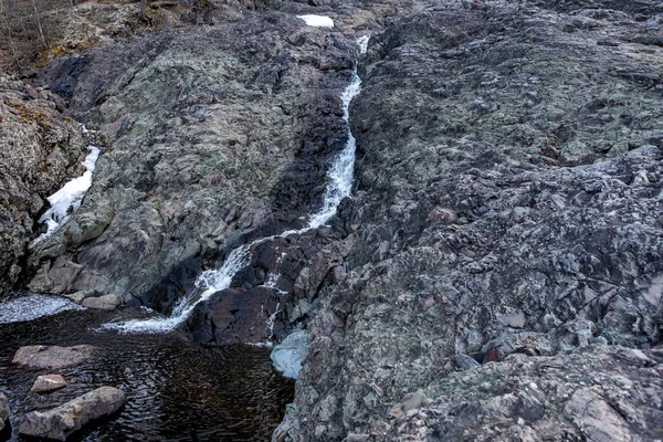 Water flows into the old crater of an extinct prehistoric volcano — Stock Photo, Image