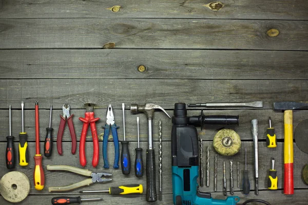 Tools in the workshop.On the table are tools for various types of construction and repair work on wood, metal, concrete, plastic and other materials.