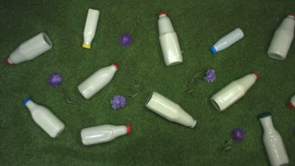 Milk Grass Top View Milk Bottles Various Shapes Lies Grass — 비디오