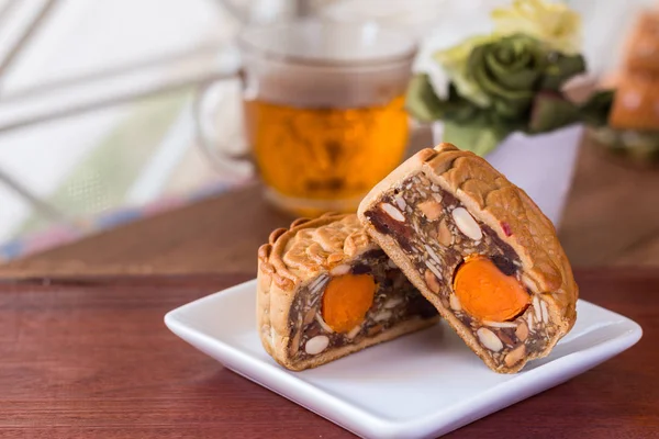 Moon cake and tea - Chinese traditional moon cakes on white plat