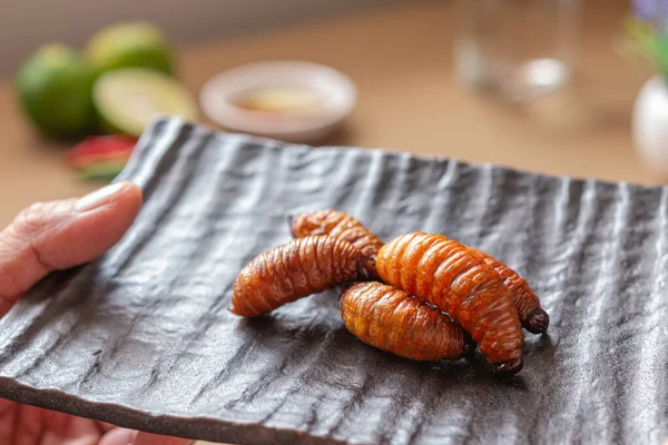 Fried Worm, Insect food with vegetables in the brown bowl. Close