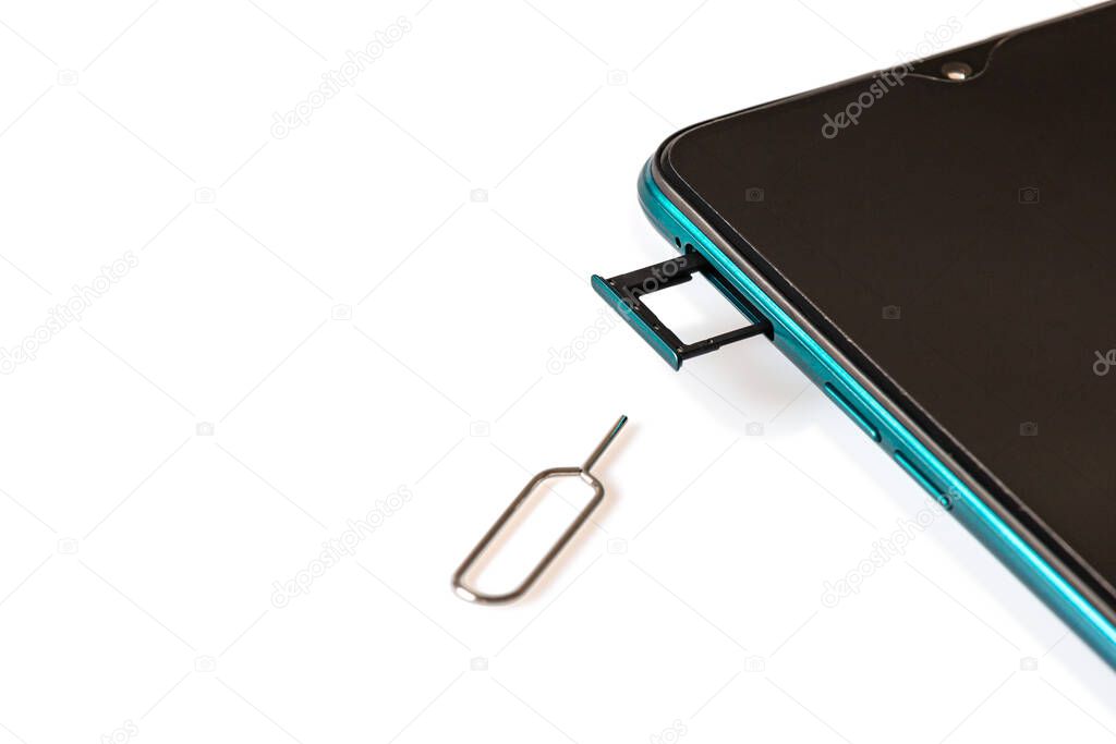 Sim card tools, Small nano sim card, and Micro SD card tray with smartphones isolated on white background. Selective focus. 