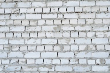 Arka plan doku bir beyaz tuğla duvar çimento ile dikişleri 