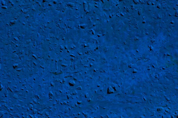 Hintergrund einer tiefblauen Stuckschicht beschichtet und bemalt außen, grob gegossen aus Zement und Beton Wandstruktur, dekorative Beschichtung — Stockfoto