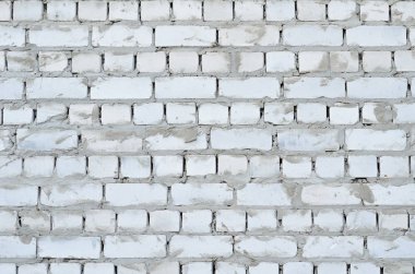 Arka plan doku bir beyaz tuğla duvar çimento ile dikişleri 