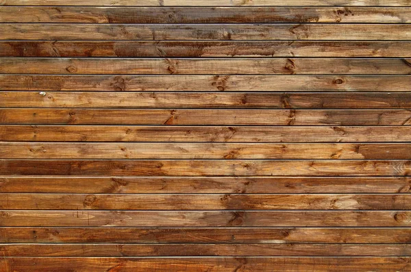 Sfondo della recinzione in legno annodato naturale. Struttura in legno . — Foto Stock