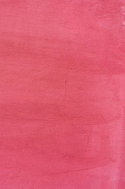 Pembe bir sıva arka plan kaplamalı ve boyalı dış, kaba dökme çimento ve beton duvar doku, dekoratif kaplama