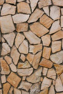 Decorative modern stone wall of chipped stone for background clipart