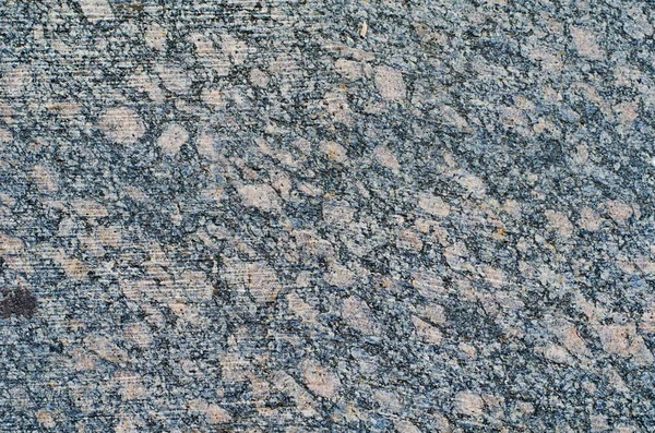 Υφή της φυσικής πέτρας σκούρο με εγκλείσματα, φόντο — Φωτογραφία Αρχείου