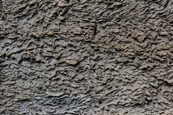 Hintergrund einer grauen Stuckschicht beschichtet und bemalt außen, grob gegossen aus Zement und Beton Wandstruktur, dekorative Beschichtung — Stockfoto