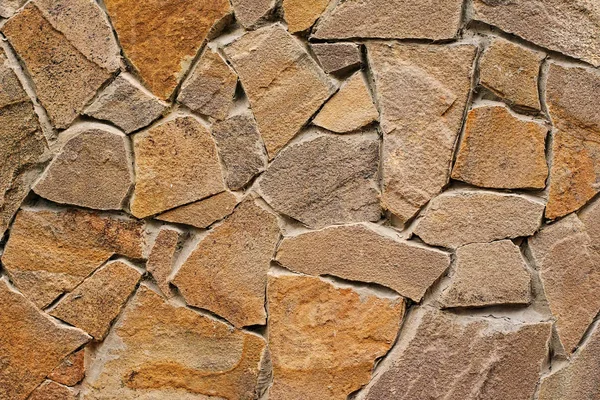 Декоративна сучасна кам'яна стіна з подрібненого каменю для фону — стокове фото