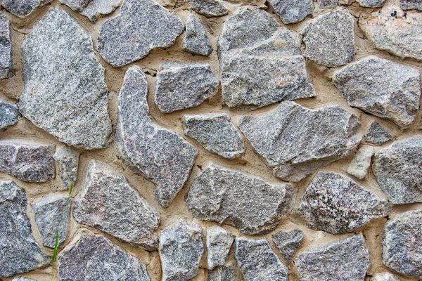 Decorative modern stone wall of chipped stone for background — Stock Photo, Image