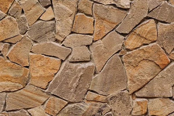 Decorative modern stone wall of chipped stone for background Stock Picture