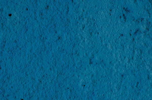 Derin mavi sıva arka plan kaplamalı ve boyalı dış, kaba dökme çimento ve beton duvar doku, dekoratif kaplama 