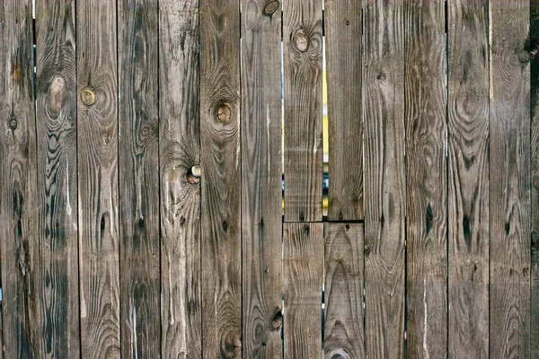 Background of natural knotted wood fence. Wooden texture. — Stock Photo, Image