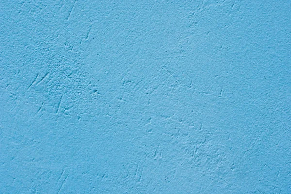 Fundo de uma parede de cimento pintado azul, elenco áspero de cimento e textura de parede de concreto, revestimento rústico decorativo — Fotografia de Stock