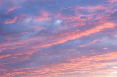 Dramatic sunset cloudy sky background, twilight pink and purple colors