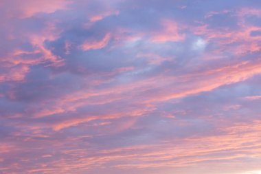 Dramatic sunset cloudy sky background, twilight pink and purple colors