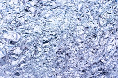 Arka plan için parlak ayna yüzeyi olan gümüş folyo dokusu