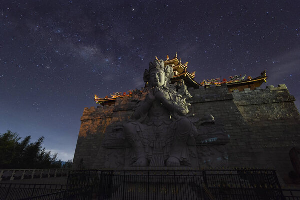 Milky Way above Guan Yin statue at 500 Lohan Temple, Bintan Island