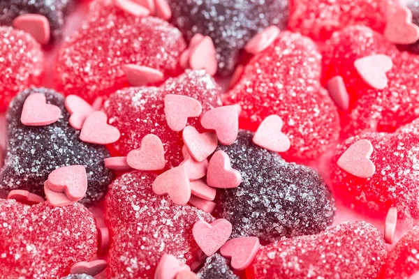 Chewy candies in a powdered sugar, Heart shaped gelatinous sweets