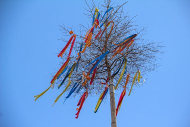 Maypole, decorated with colored ribbons clipart