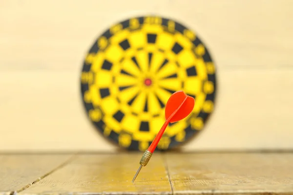 The arrow did not hit the center of the dart