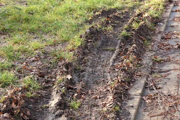 Track from the cars wheel tread in the autumn mud — Stock Photo, Image