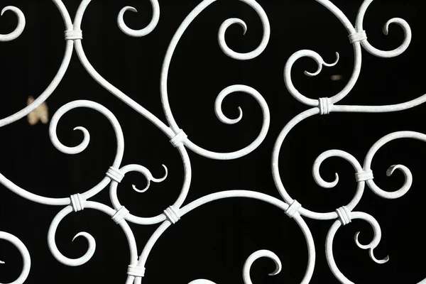 Metal fence. Metal curly fence in the park