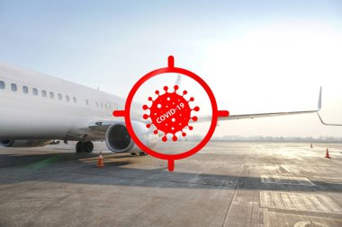 Bir uçağın arka planında koronavirüs uyarısı var. Yeni bir tehdit karşısında, küresel bir salgın ve karantina. COVID-19 uçakların havalanmasını engelliyor