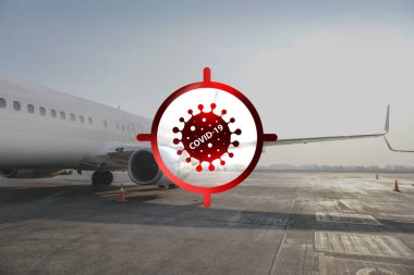 Bir uçağın arka planında koronavirüs uyarısı var. Yeni bir tehdit karşısında, küresel bir salgın ve karantina. COVID-19 uçakların havalanmasını engelliyor