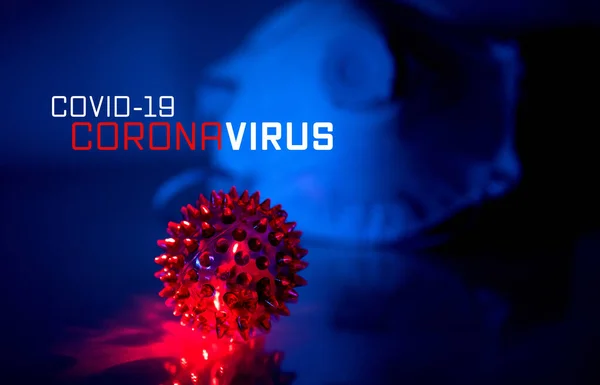 Corona Virus Concept:  COVID-19, Corona Virus text on a blue futuristic background and anti virus protection mask