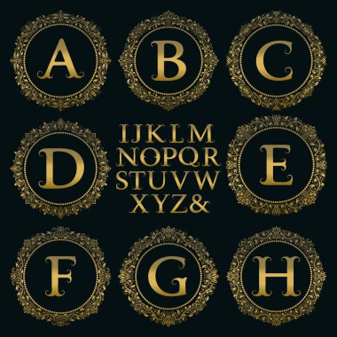 Vintage monogram kiti. Altın harfler ve Victoria tarzı ilk logo oluşturmak için çiçek yuvarlak çerçeve.
