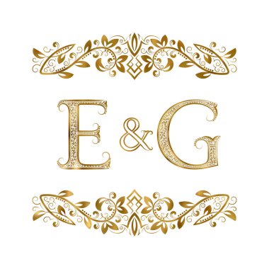 E ve G vintage baş harfleri logo sembolü. Harfleri süs öğeleri tarafından çevrili.