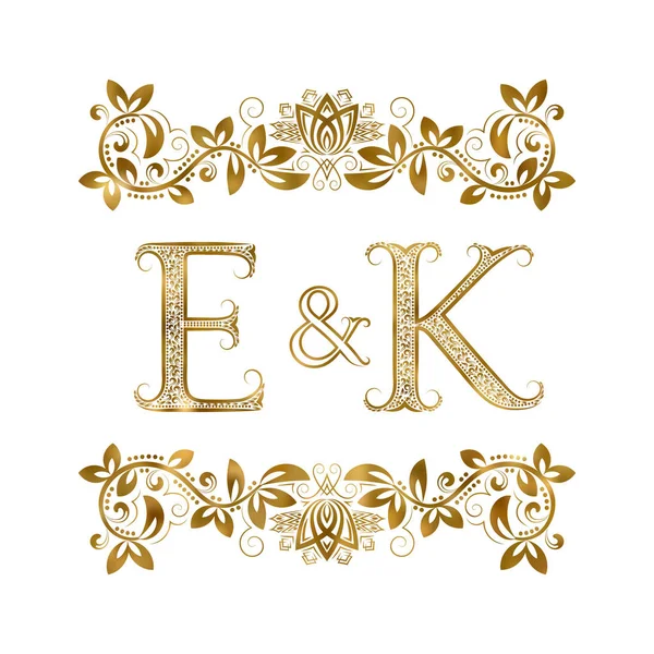 E and K vintage initials logo symbol. The letters are surrounded by ornamental elements. — Stock Vector